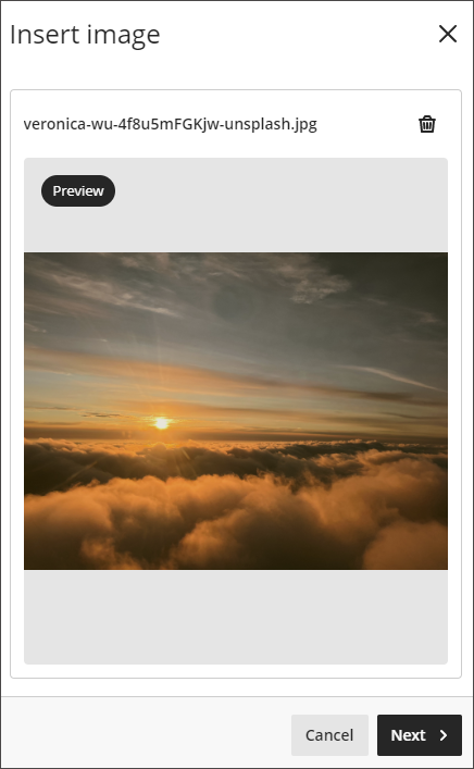 The Insert Image window for the banner, showing a preview of a clouds.