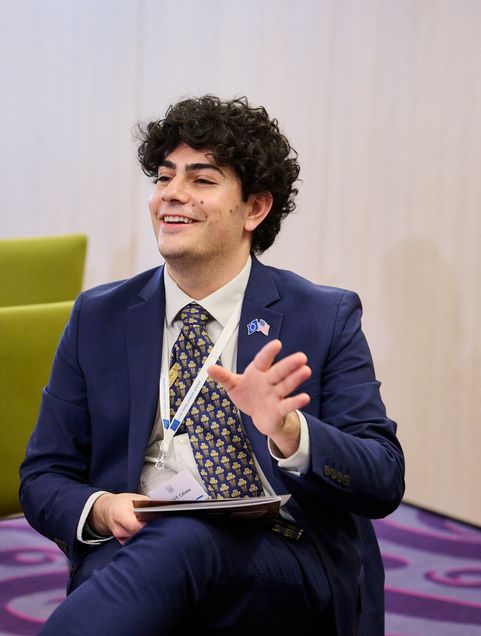 Gabriel Calistro in a suit at the EU-US Young Leaders Seminar