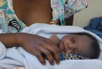 A mother in sub-Saharan Africa holds her infant