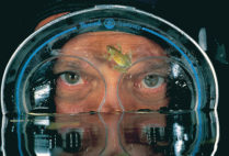 David Doubilet with reed frog on his mask while on assignment Okavango Delta Botswana