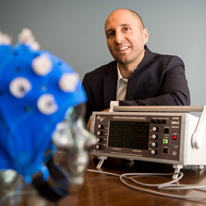 Prof Rob Reinhart has a new paper coming out in PNAS.  In his research, he has been able can up-regulate or down-regulate cognitive performance via non-invasive brain stimulation in health humans. Pictured here with some equipment including a high definition cranial electrical current stimulator.Prof Rob Reinhart has a new paper coming out in PNAS.  In his research, he has been able can up-regulate or down-regulate cognitive performance via non-invasive brain stimulation in health humans. Pictured here with some equipment including a high definition cranial electrical current stimulator.