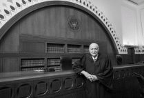 Judge Juan Torruella posing in the courtroom
