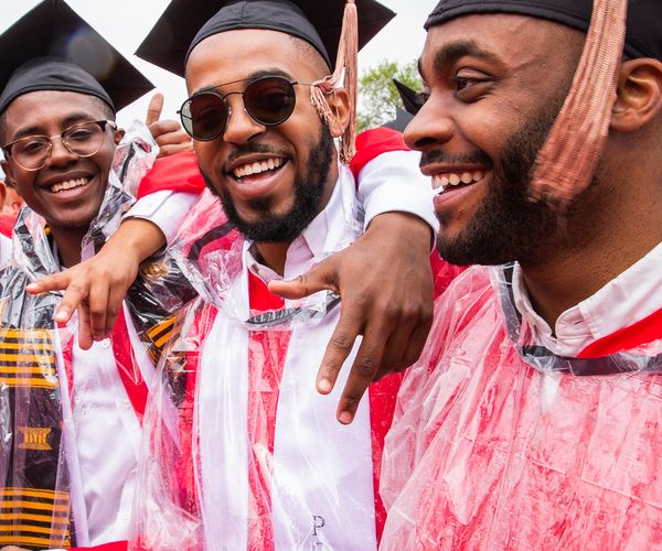 3 black men in graduation cap and gowns