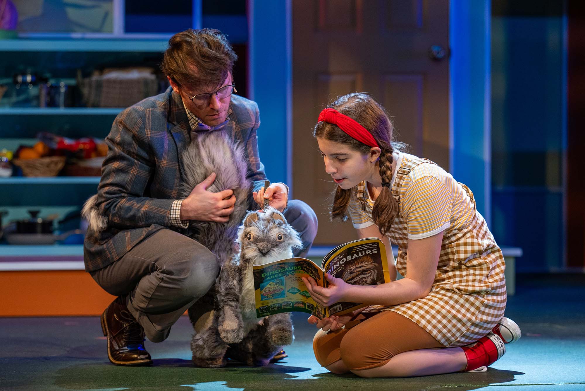Ulysses, played by Chris Stahl (left), is a squirrel rescued by Flora (Livie Ketri) in a scene from Wheelock Family Theatre’s production of Flora & Ulysses, based on Kate DiCamillo’s best-selling children’s book.