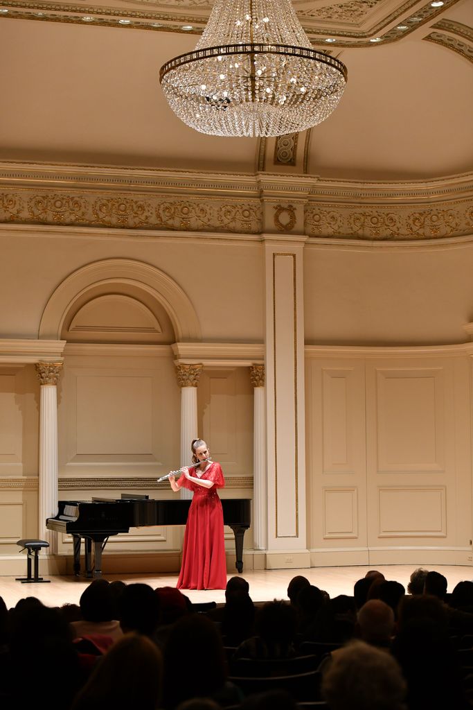 Flutist performing on stage in Weill Recital Hall at Carnegie Hall for Boston University Spotlight Concert