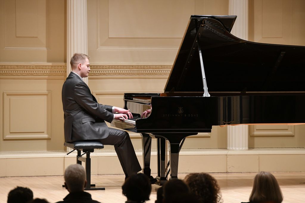 Pianist performing on stage at Weill Recital Hall at Carnegie Hall