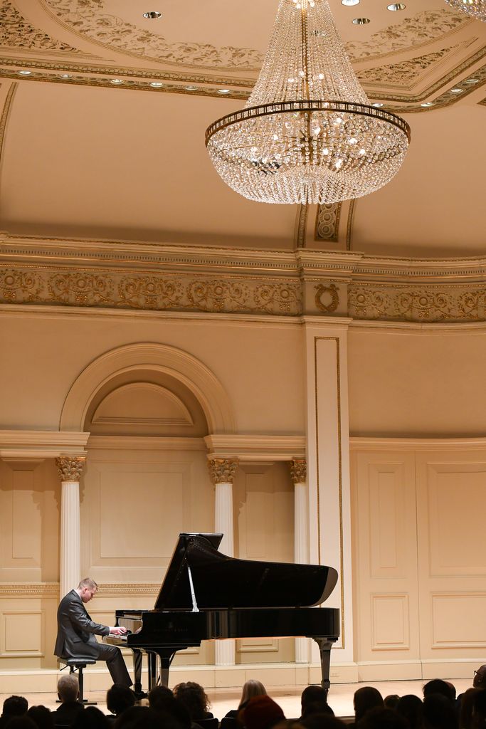 Pianist performing on stage at Weill Recital Hall at Carnegie Hall