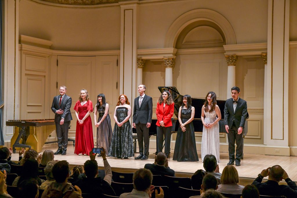 Boston University musicians taking a bow on stage at Weill Recital Hall at Carnegie Hall