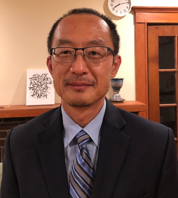 An Asian man picture with black suite