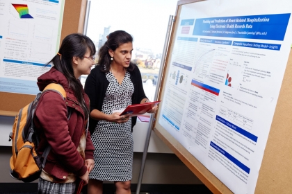 BU 系统工程 PhD student Tingting Xu and ECE PhD student Theodora Brisimi during a poster session