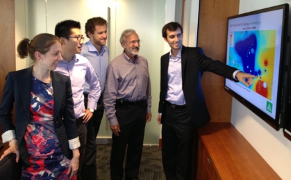 The ARPA-E project research team at BU--Visiting Researcher Rebecca Carroll (ME), Research Fellow Xiaoguang (Xiao) Li (ME) and PhD student Evgeniy Goldis (SE) and co-principal investigators Professor Michael Caramanis (ME, SE) and Research Associate Professor Pablo Ruiz (ME)--viewing a map of congestion in the PJM power transmission network.