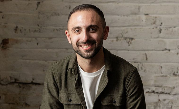 Mike De Socio smiling portrait.