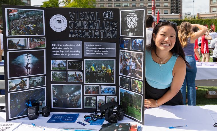Student smiling at VJA exhibition