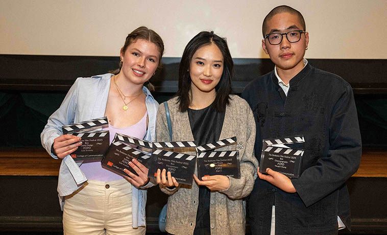 First place winner Pópo also won best cinematography, best editing, and best sound design. Accepting the awards were Pópo’s editor, Sadie Kennedy (COM’26) (from left), director and producer, Jingyi Li (COM’25), and cinematographer, Meng Kai Cheang (COM’25). Film & TV Student-Directed Documentary of Immigrant Family Supporting Their Dying Mother Wins First Place at COM’s Redstone Film Festival Annual Boston University competition celebrates the year’s best student films and scripts April 5, 2025