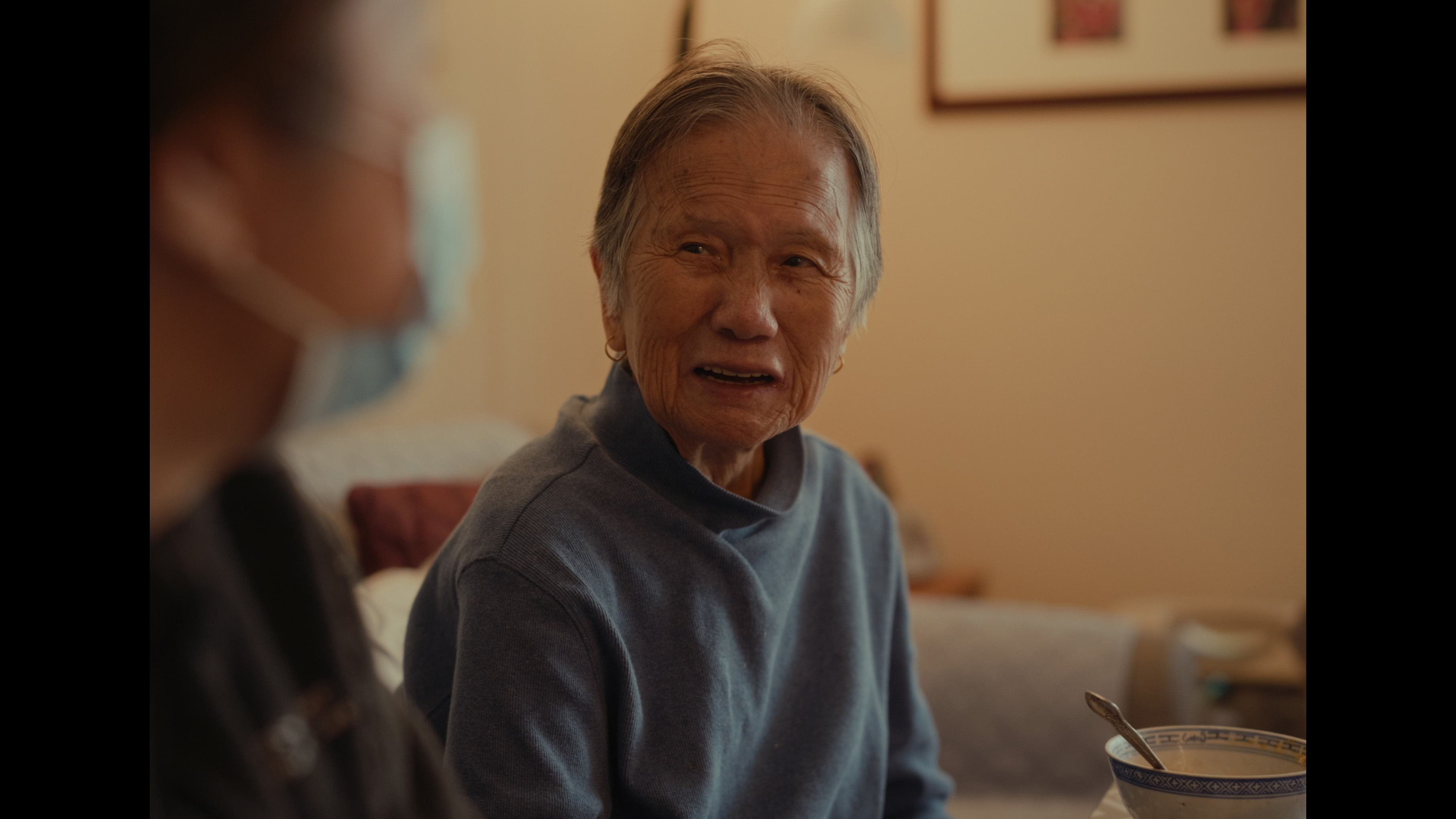 Elderly woman in conversation.