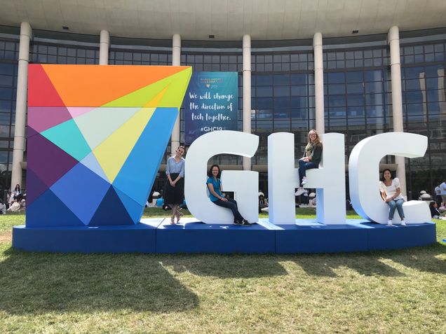 Attendees pose outside of the Orange County Convention Center in Orlando, FL.