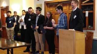 The students accept their award at the AIAA regional student conference. 
