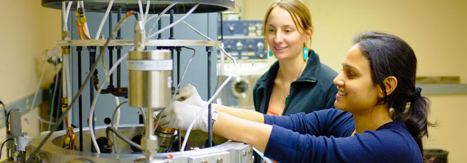 Two students working in a lab
