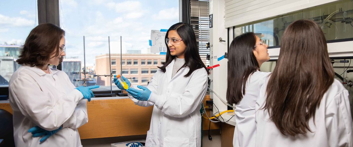 Societal Eng Banner Thumbnail v3, student in lab