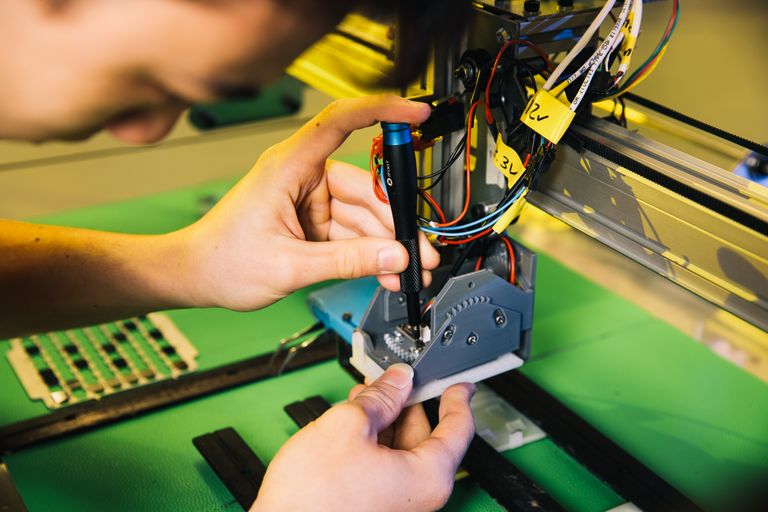 Mechanical Engineering student setting up equipment for a project