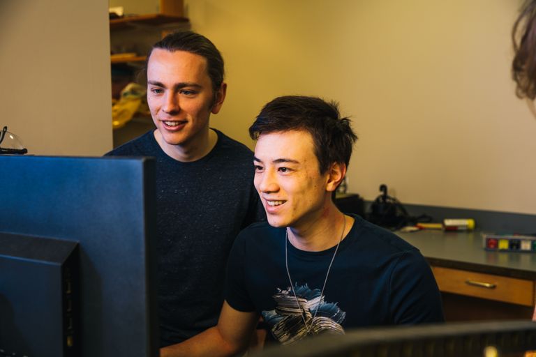 Two students looking at a computer screen