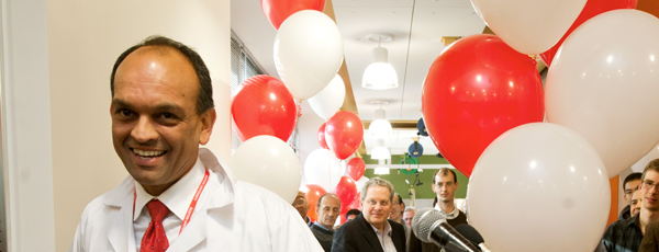 Binoy K Singh in 2011 at the grand opening of SILab with red and white balloons in the background