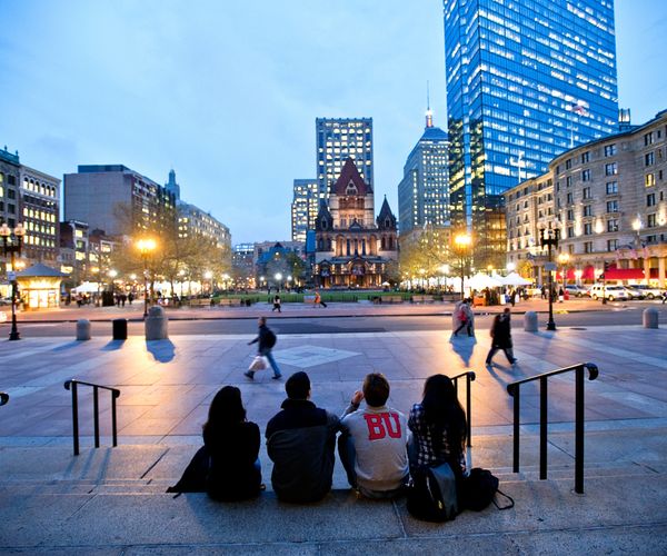 BU students sitting on the steps of the Boston Public Library