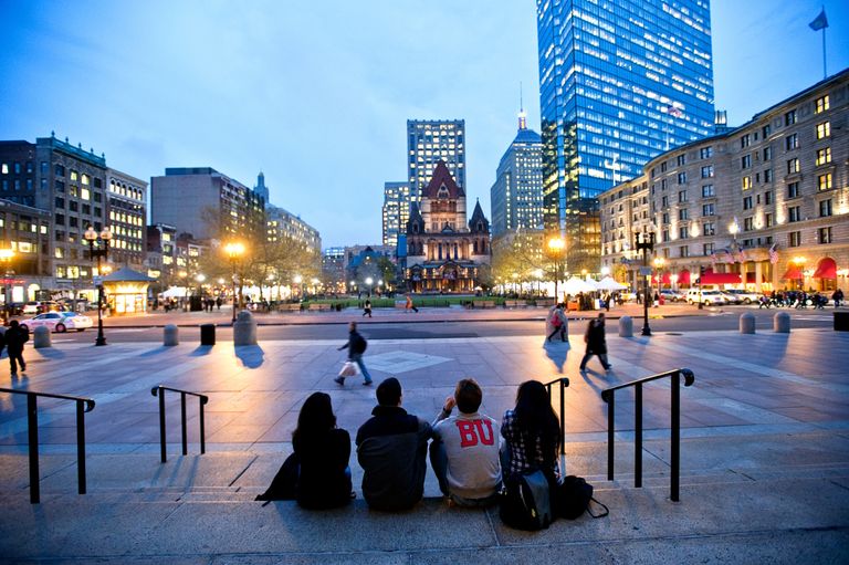 BU students sitting on the steps of the Boston Public Library