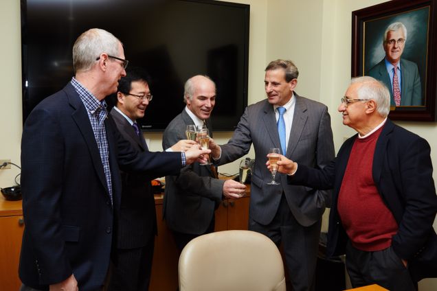 Professor Ji-Xi Cheng (second from left) celebrates his appointment as the inaugural Moustakas Professor in Photonics and Optoelectronics with colleagues Professor and ECE Department Chair W. Clem Karl (from left), Professor Thomas Bifano, Dean Kenneth R. Lutchen, and Distinguished Professor of Photonics and Optoelectronics Emeritus Theodore Moustakas. Photo by Dave Green