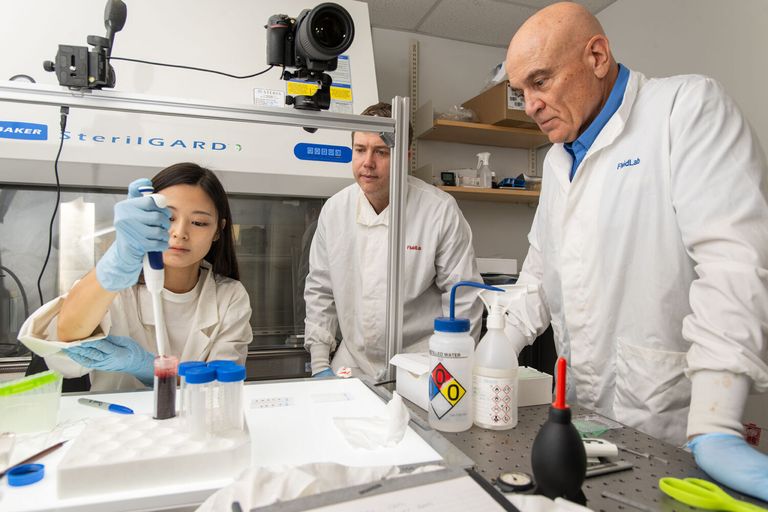 Prof. Bird in lab studying blood stain patterns