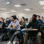Student sitting attentively in class.