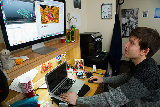 Christopher McGlade, founder of Lightning Man Media, at work designing a video game