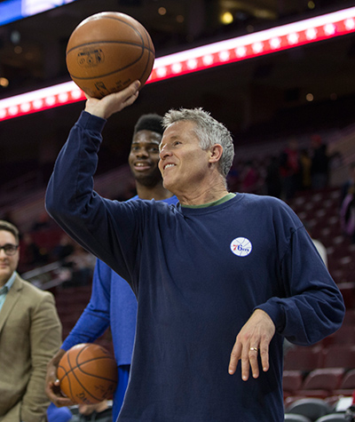 Philadelphia 76ers head coach Brett Brown shooting baskets with player Nerlens Noel