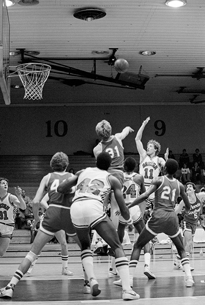Brett Brown (no.11) takes a shot during the BU men's basketball game against Souther Florida in Case Gym on January 4, 1982.