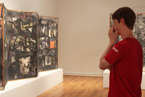 A Call for Peace: Abe Fleischer (COM '17) reacts to panels by Japanese artists Iri and Toshi Maruki as part of the Stone Gallery commemorative exhibit for the 70th anniversary of the Hiroshima bombings. The artists, a Japanese couple who visited Hiroshima just days after the nuclear bombing, would produce a series of fifteen panels over the course of thirty years to pay homage to Japanese victims as well as American prisoners of war who perished on August 6, 1945.