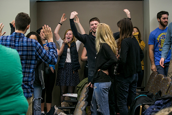 Students cheer as they convince others to join the backing for John Kasich during a mock Iowa Caucus in Professor Douglas Kriner's PO 301 class on the American Presidency. His lecture discussed the difference between primaries and caucuses and further, the unique rules on both the democratic and republican side.