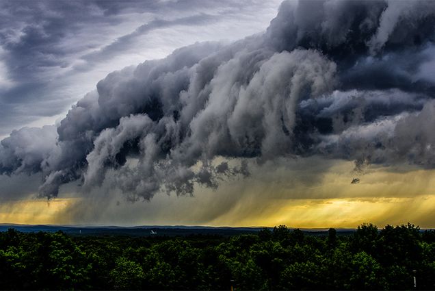 View of distant rain storm and storm clouds