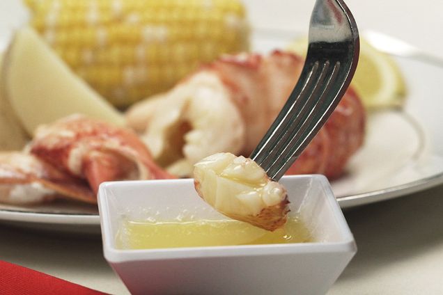 piece of lobster meat dipped in butter