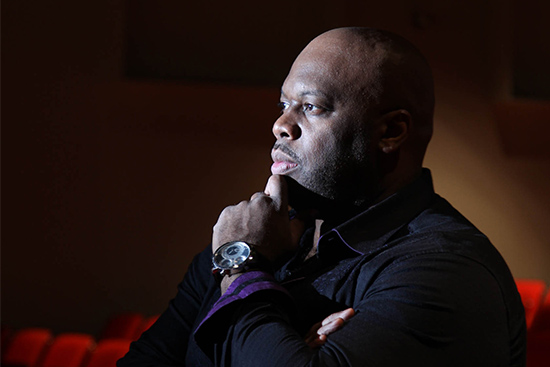 Opera bass vocalist Morris Robinson poses for a portrait in a theatre
