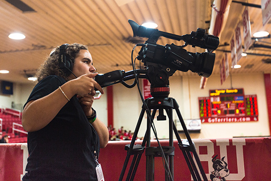 student video taping a game