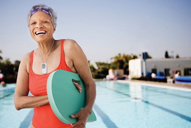 Healthy senior with swimming board