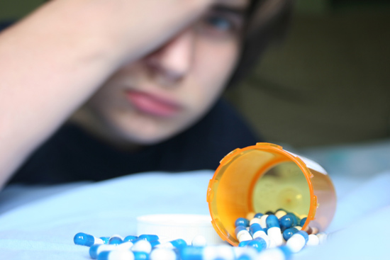 adolescent with pills