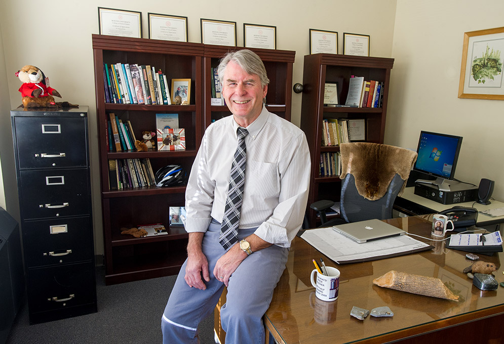 Peter Busher, CGS professor, displays runs from fur to fossils in his office