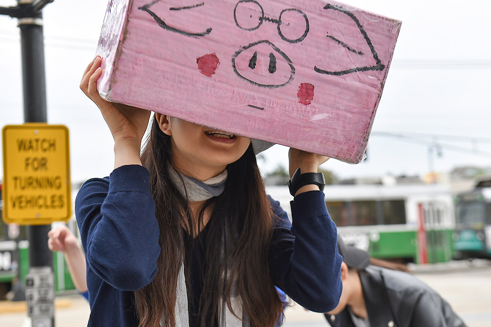 Ying Yao looking through pinhole camera
