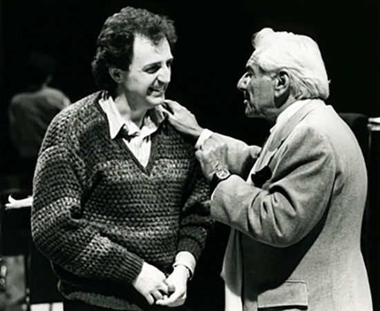 Archival photo of Grammy-winning conductor Bramwell Tovey speaking with famed composer and conductor Leonard Bernstein