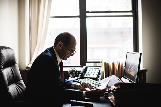 Spotlight lawyer Mitchell Garabedian working in his Boston office