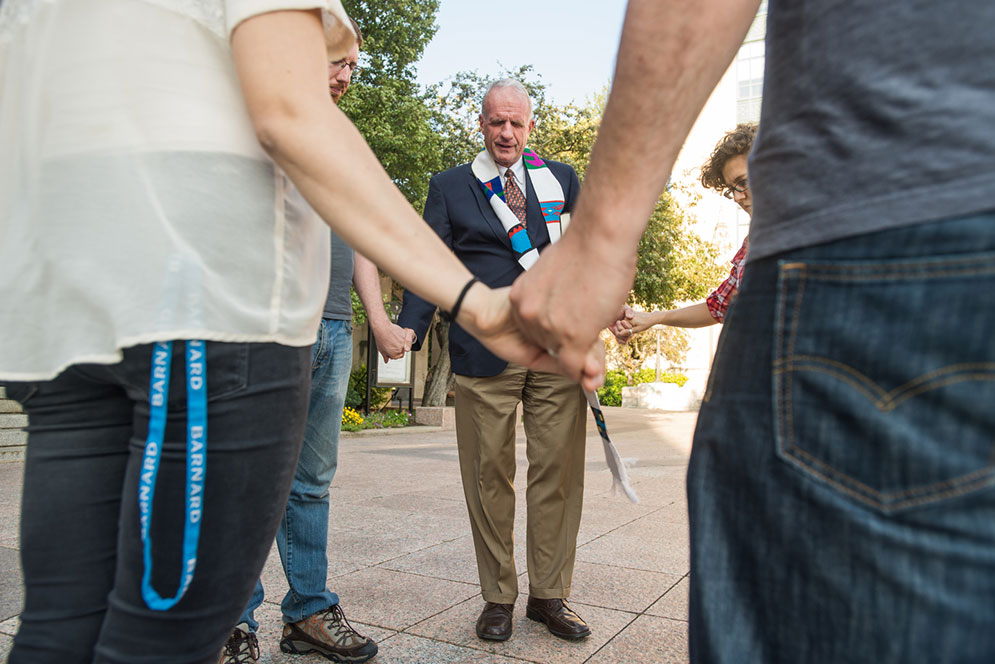 At a prayer vigil on Marsh Plaza September 5, Robert Allan Hill, dean of Marsh Chapel, led a moment of silent meditation for those affected by the Trump order ending President Obama’s Deferred Action for Childhood Arrivals program