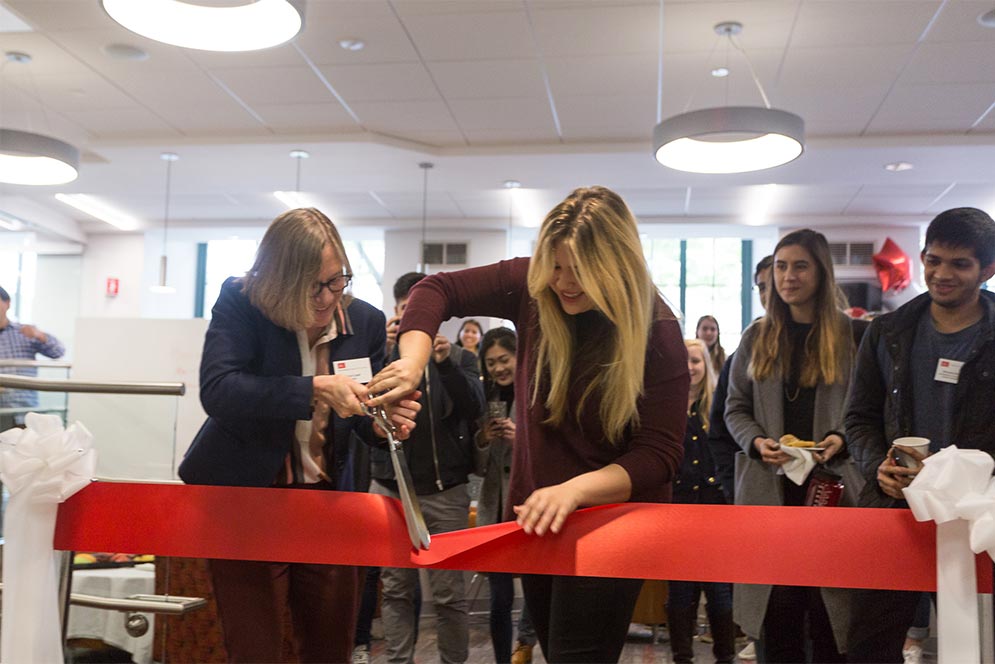 Ann Cudd, dean of Arts & Sciences (left), and Christina Lucas (CAS’17) cut the ribbon for the CAS Think Tank Study Lounge May 1. Lucas, a former CAS Student Government president, suggested the idea for the study lounge.