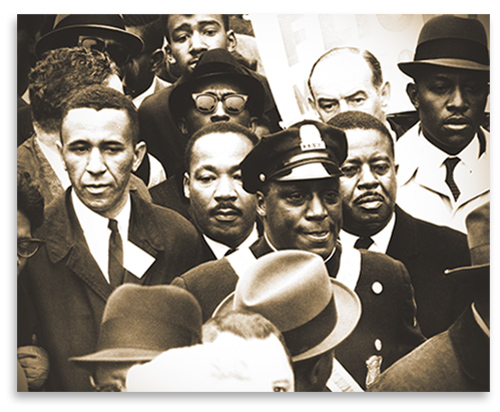 Rev. Gil Caldwell, Dr. Martin Luther King, Jr., and Rev. Ralph Abernathy lead a march to Boston Common to protest segregation in schools, April 23, 1965.