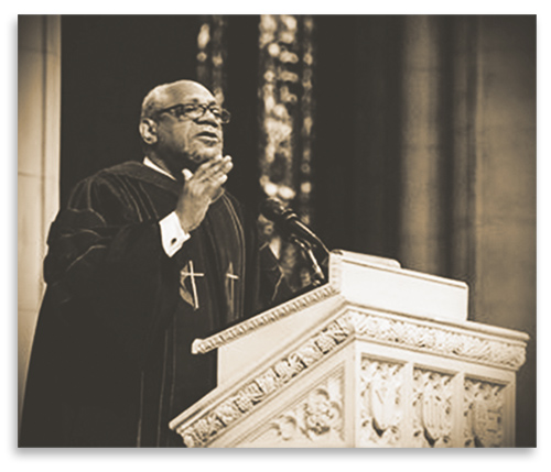 Rev. Bobby McClain preaching during a service